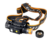 Fenix headlamp with orange accents on a white background