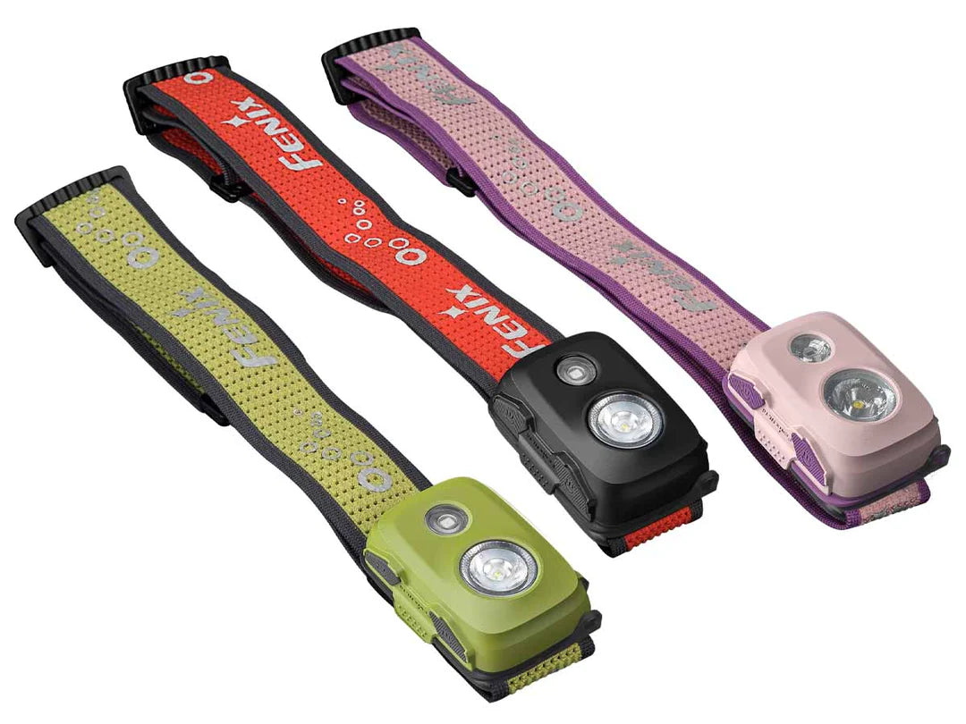 Three Fenix HL16 Parent-Child Headlamp  in red, green, and pink on a white background