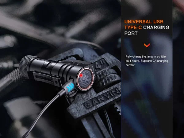 Black flashlight with USB charging port on a dark background
